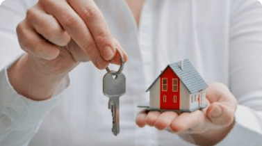 Person holding house and Its keys