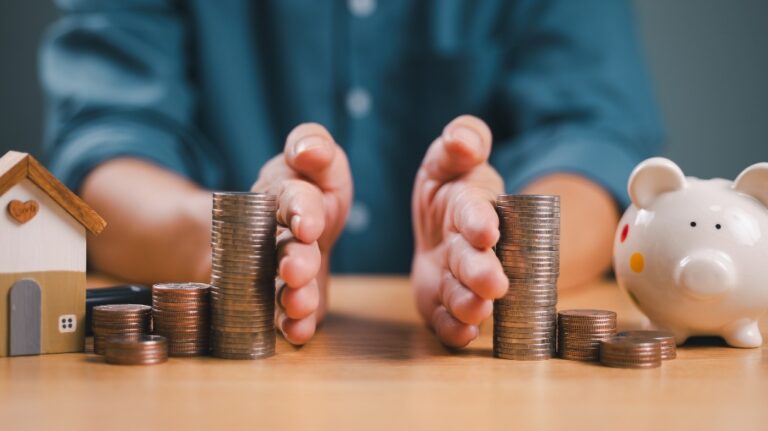 Money and house being split in half