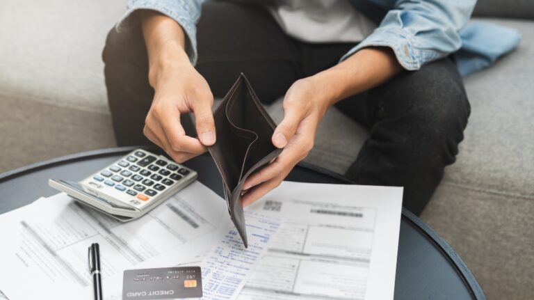 male opens empty wallet