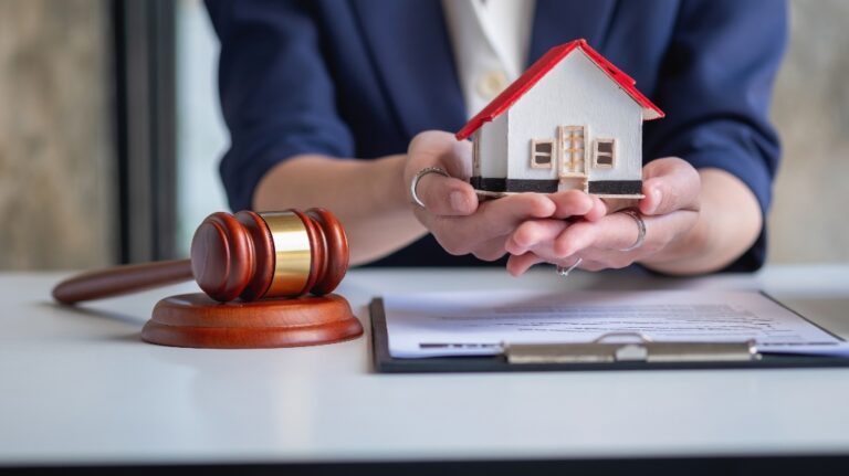 lawyer is holding house model