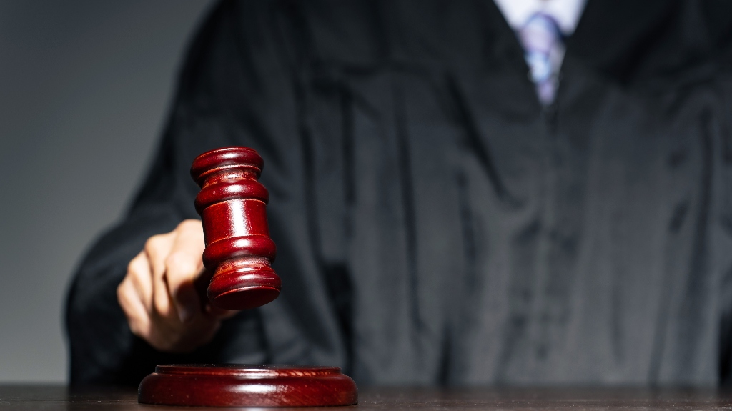 A judge hitting a mallet