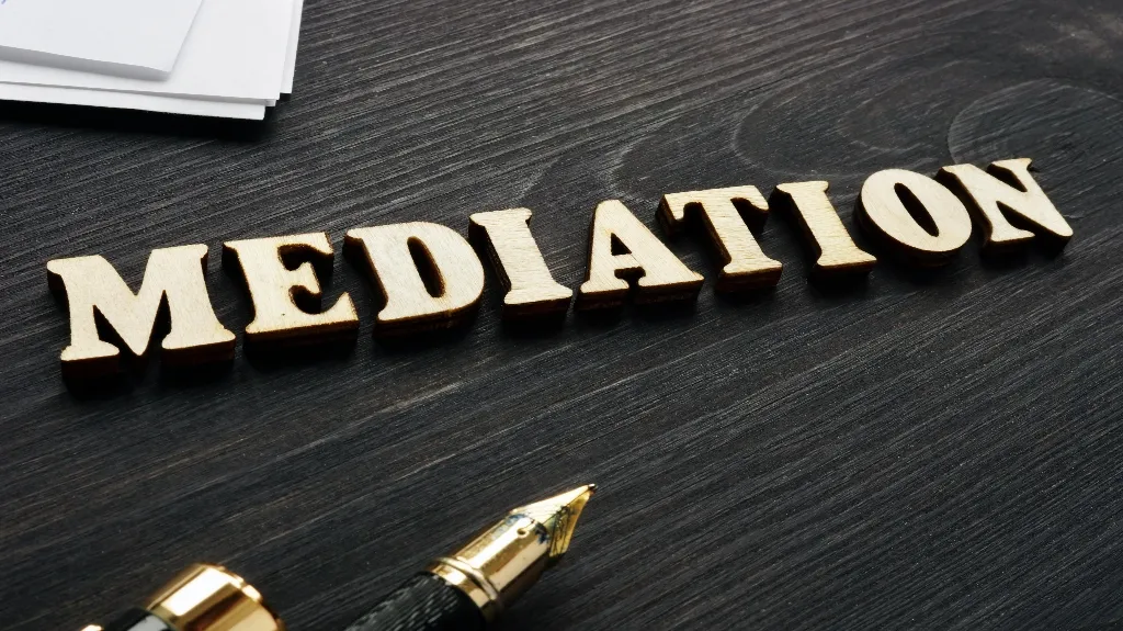 mediation spelling out with wooden letters
