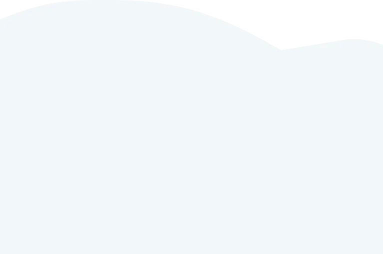 A black and white photograph of a man playing a grand piano in a dimly lit room with a microphone on a stand nearby.