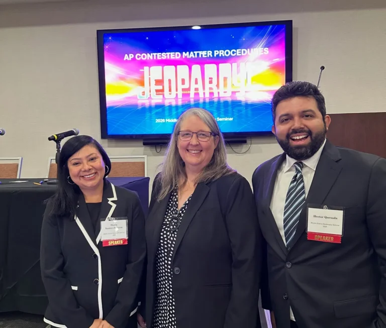 Three professional speakers posing in front of a screen displaying "AP Contested Matter Procedures Jeopardy" text.
